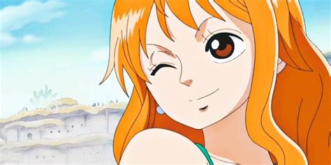 Nami sonriendo con su tripulación