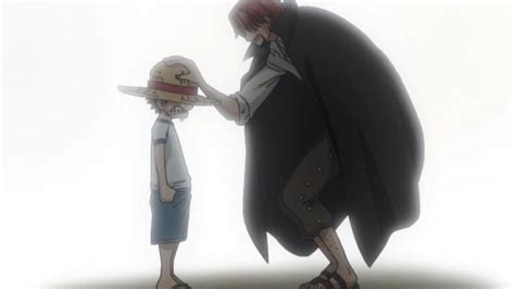 Shanks regalando su sombrero de paja a Luffy