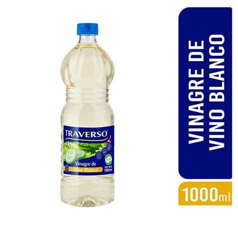 botella de vinagre blanco junto a un cepillo