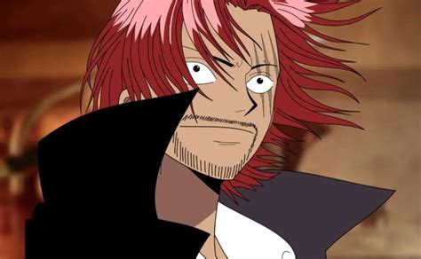 Shanks sonriendo antes de perder su brazo
