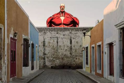 Un Titán atacando una ciudad amurallada