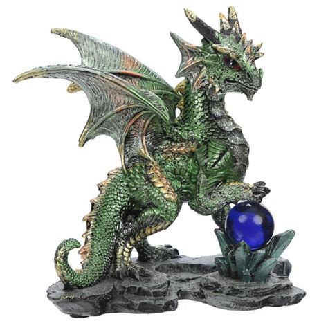figura de dragón con bola de adivinación azul